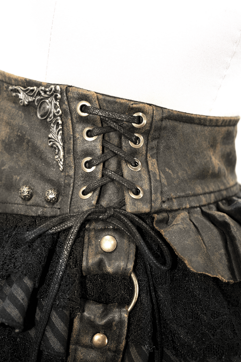 Close-up of a steampunk brown mini skirt with lace and faux leather straps, featuring a corset-style lace-up detail.