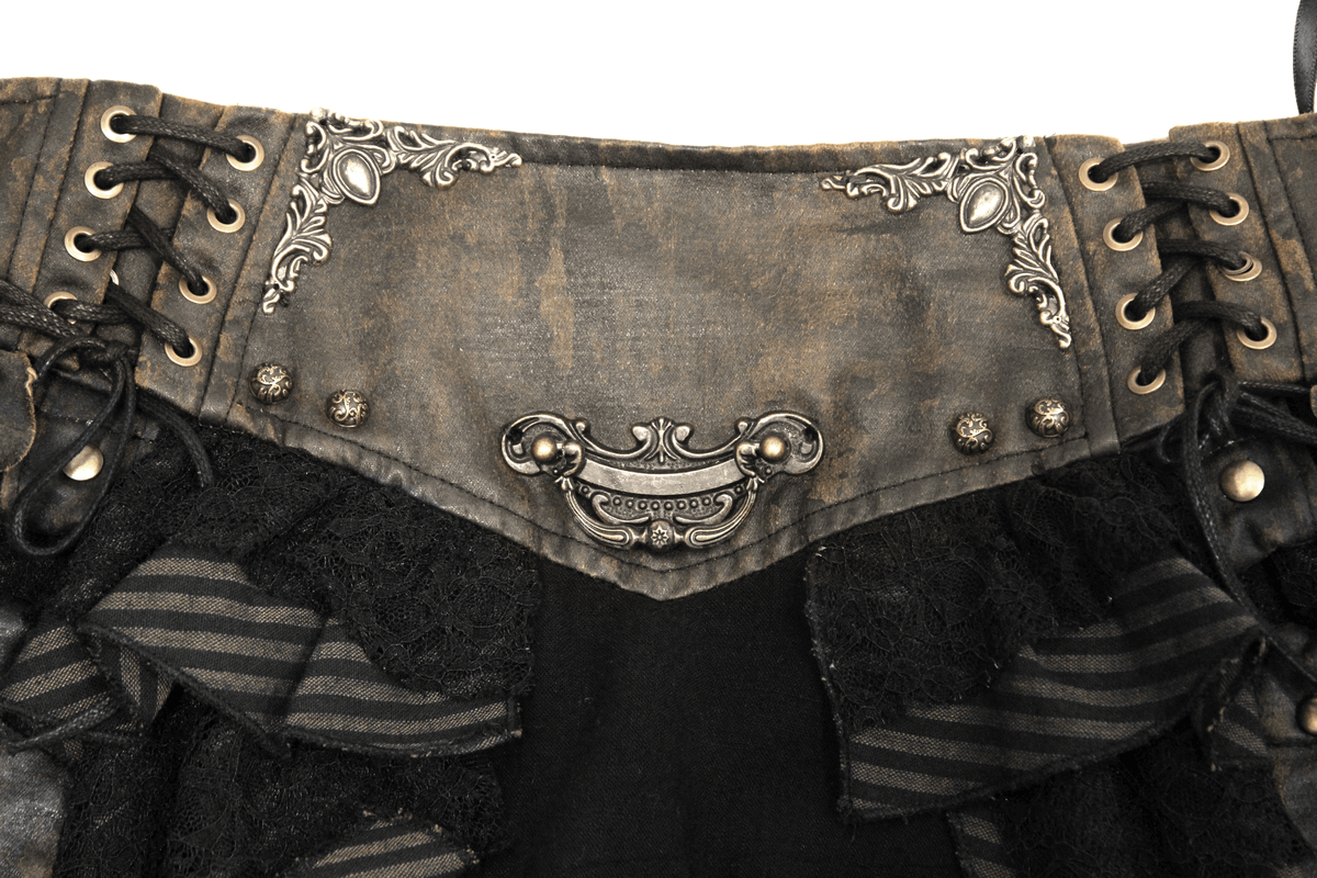 Close-up of the intricate lace and faux leather detailing on a steampunk brown mini skirt.