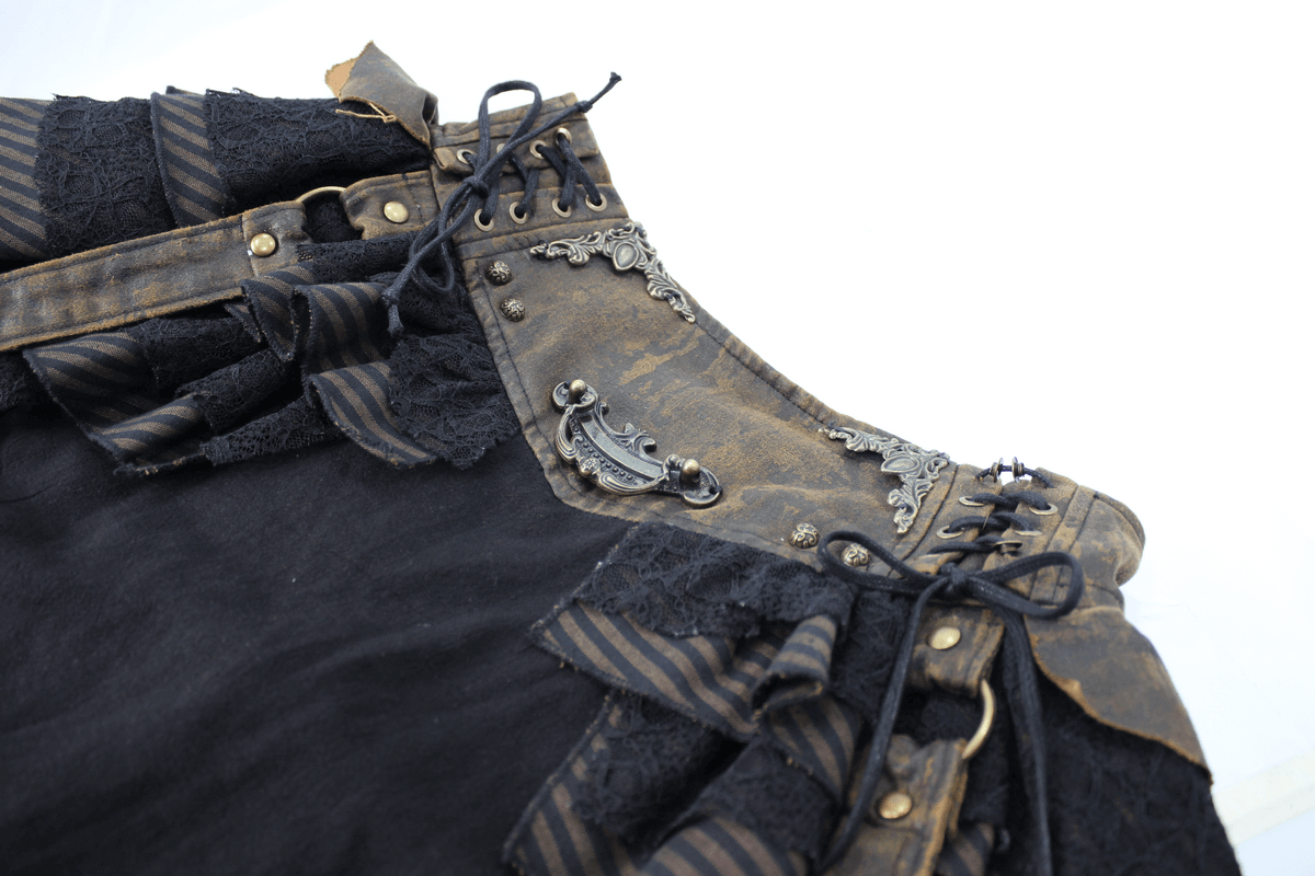 Close-up of a women's steampunk brown mini skirt featuring ruffles and faux leather straps in vintage style.