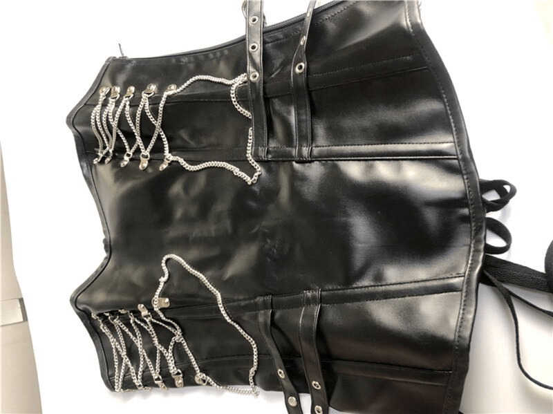 Women's steampunk corset featuring lace-up back, side chains, and sleek black design for a gothic alternative style.