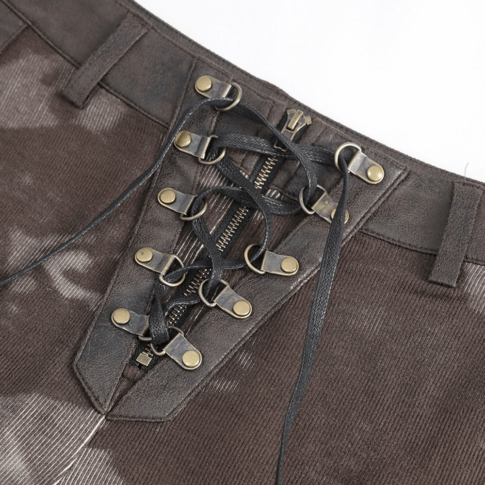 Close-up of steampunk style lace-up design on women's striped leggings with functional pockets.