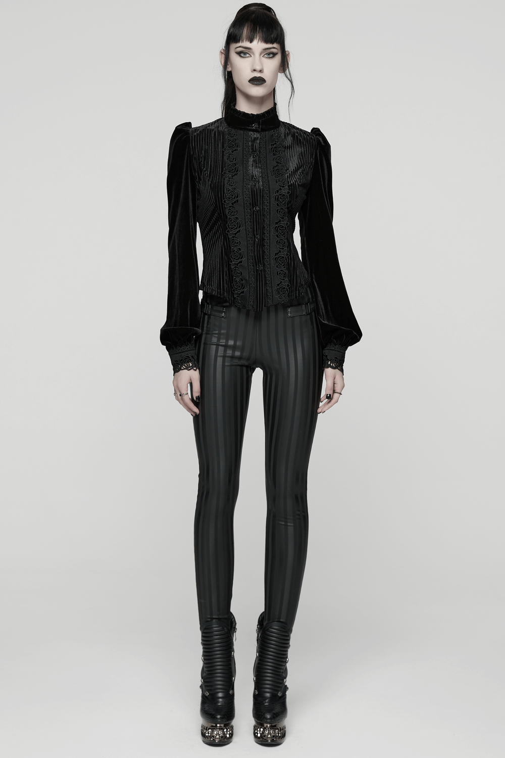 Women's Striped Leggings with Buckle Straps and Pockets paired with a gothic velvet top and edgy boots.
