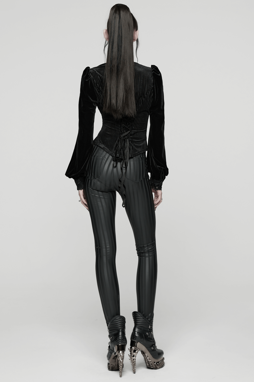 Women's Striped Leggings with Buckle Straps and Pockets showcased in sleek goth fashion.
