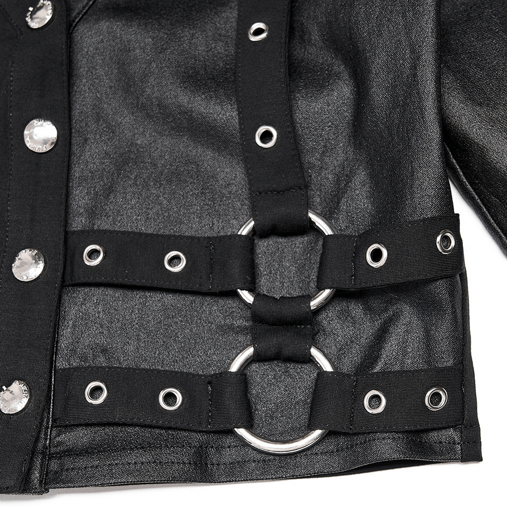 Close-up of a stylish black pullover top featuring metallic studs and eye-catching loop accents.