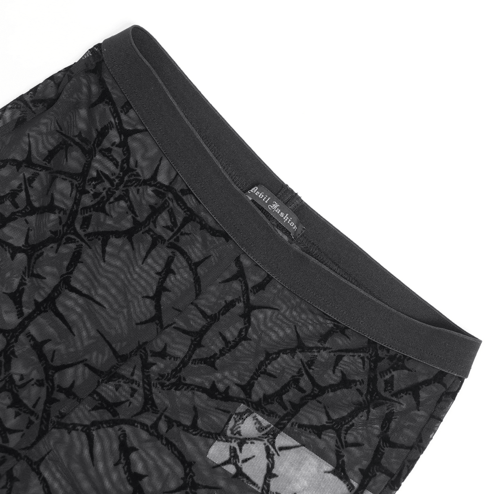 Close-up of Women's Thorn Vine Print Sheer Gothic Mesh Leggings showing black thorn vine pattern and high-rise waistband.