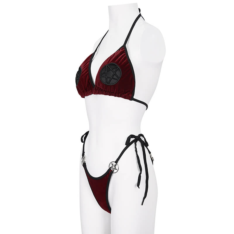 Wine red velvet bikini with pentagram accents on a mannequin, featuring a daring tie-side design for a bold alternative look.