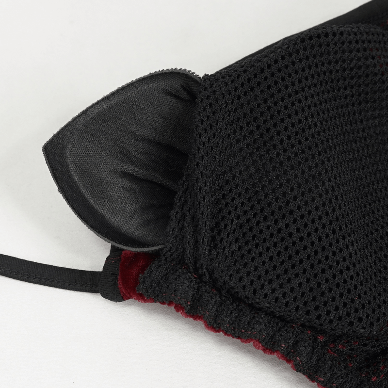 Close-up of the tie-side design of a women's wine red velvet bikini with black mesh accents.