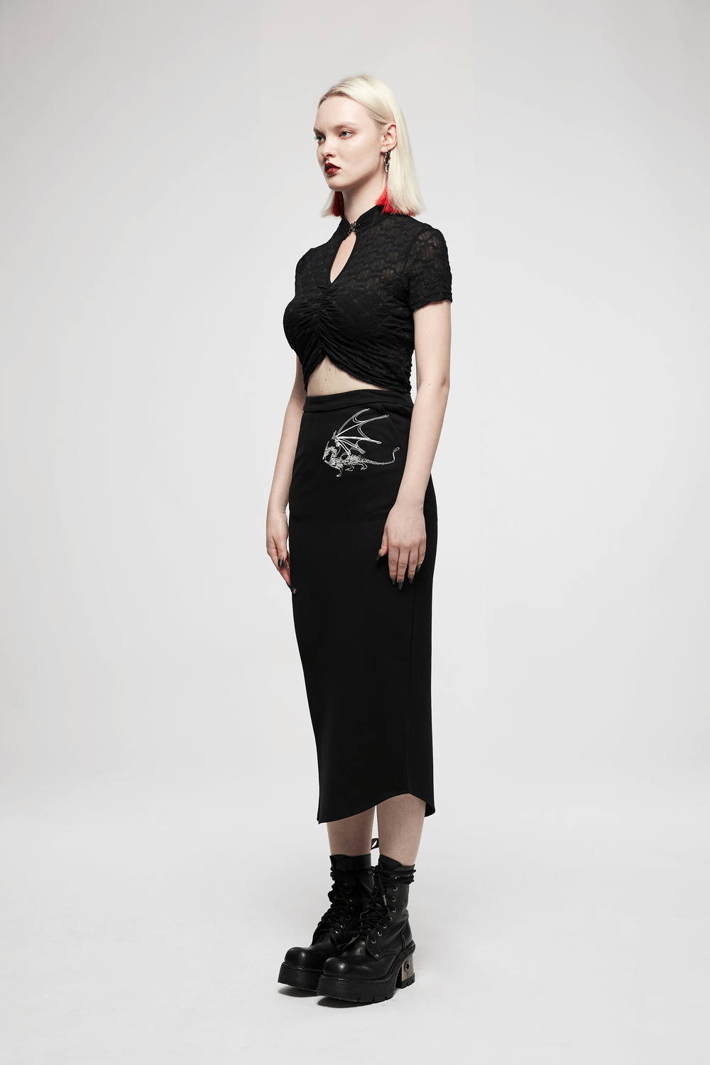 Women's dark translucent crop top with knot buckle, paired with a sleek black skirt for a gothic oriental vibe.