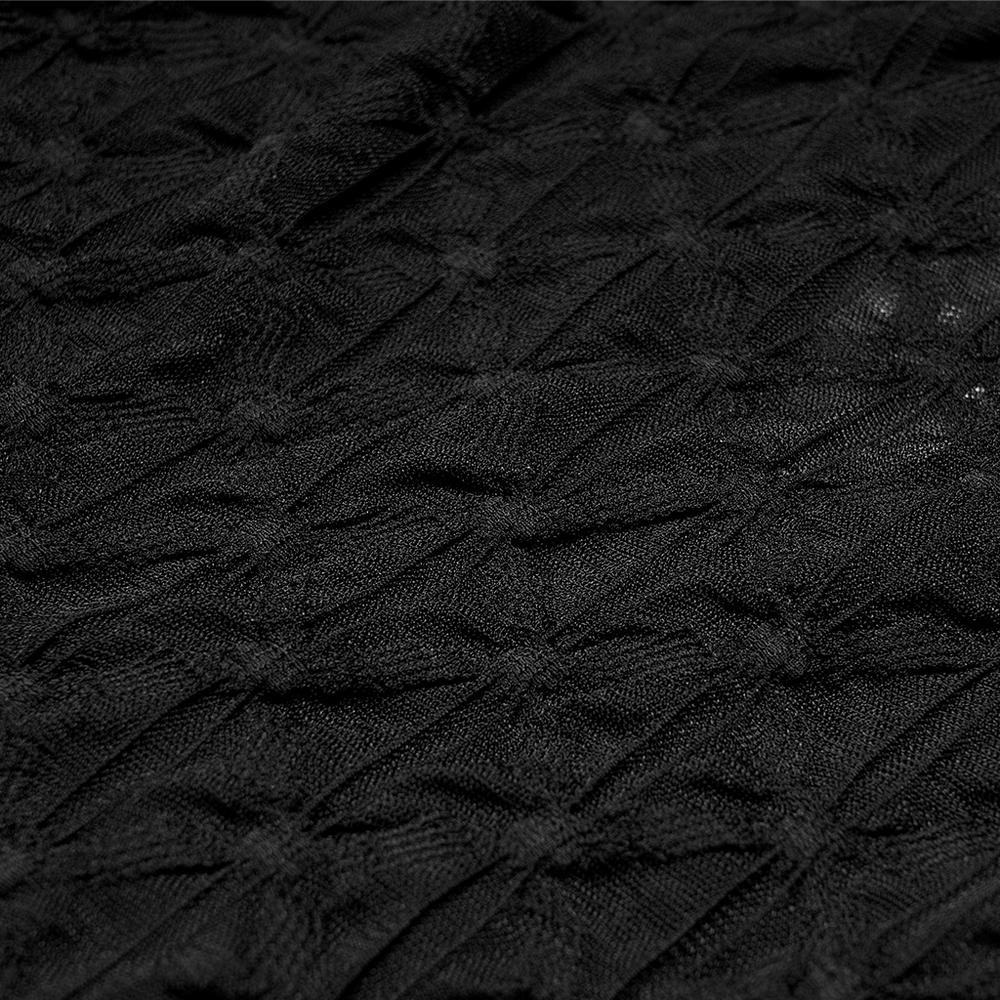 Close-up of dark translucent texture fabric with distinctive knot pattern for women's crop top.