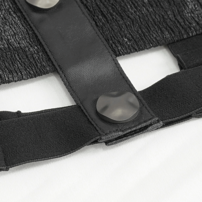 Close-up of a black turn-down collar shirt with studded detail and snap buttons, showcasing edgy punk fashion.
