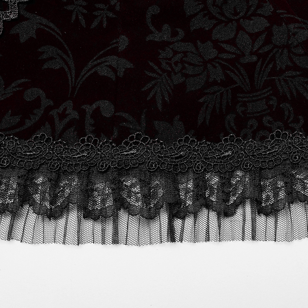 Close-up of rich black velvet fabric with intricate floral patterns and delicate lace accents for gothic corset.
