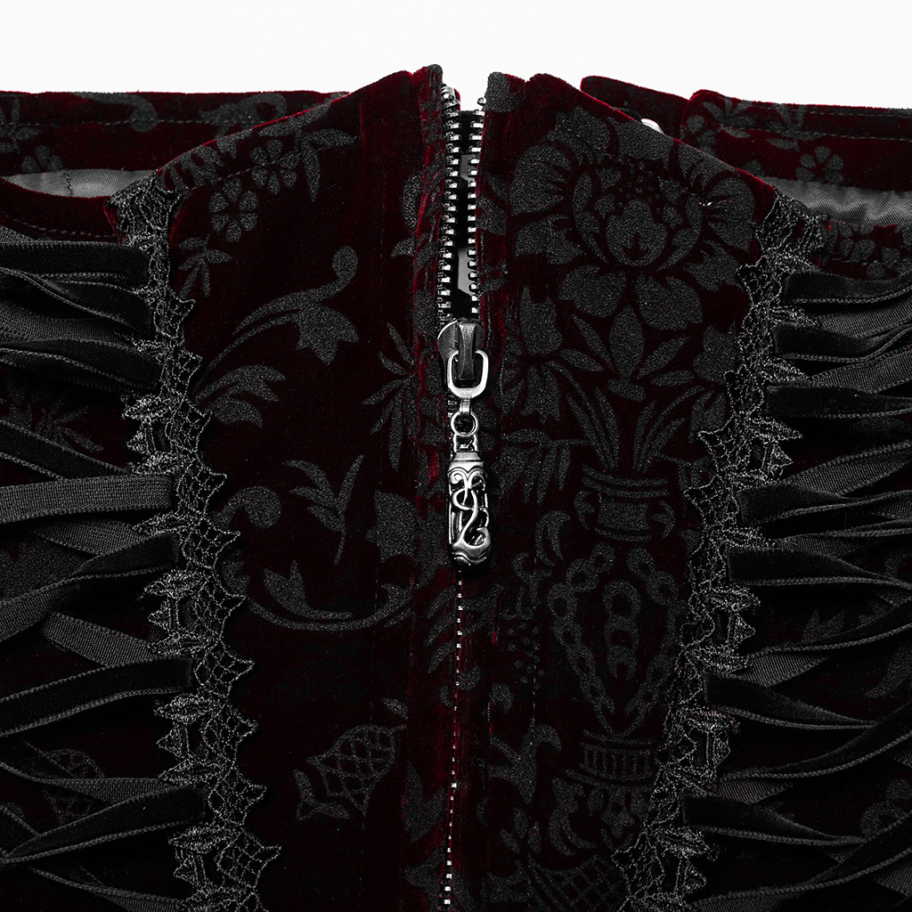Close-up of women's velvet gothic corset featuring lace accents and front zipper, showcasing intricate floral design.