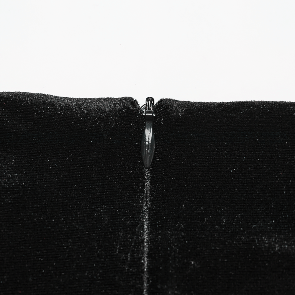 Close-up of the zipper detail on a black velvet gothic fishtail skirt for stylish elegance.