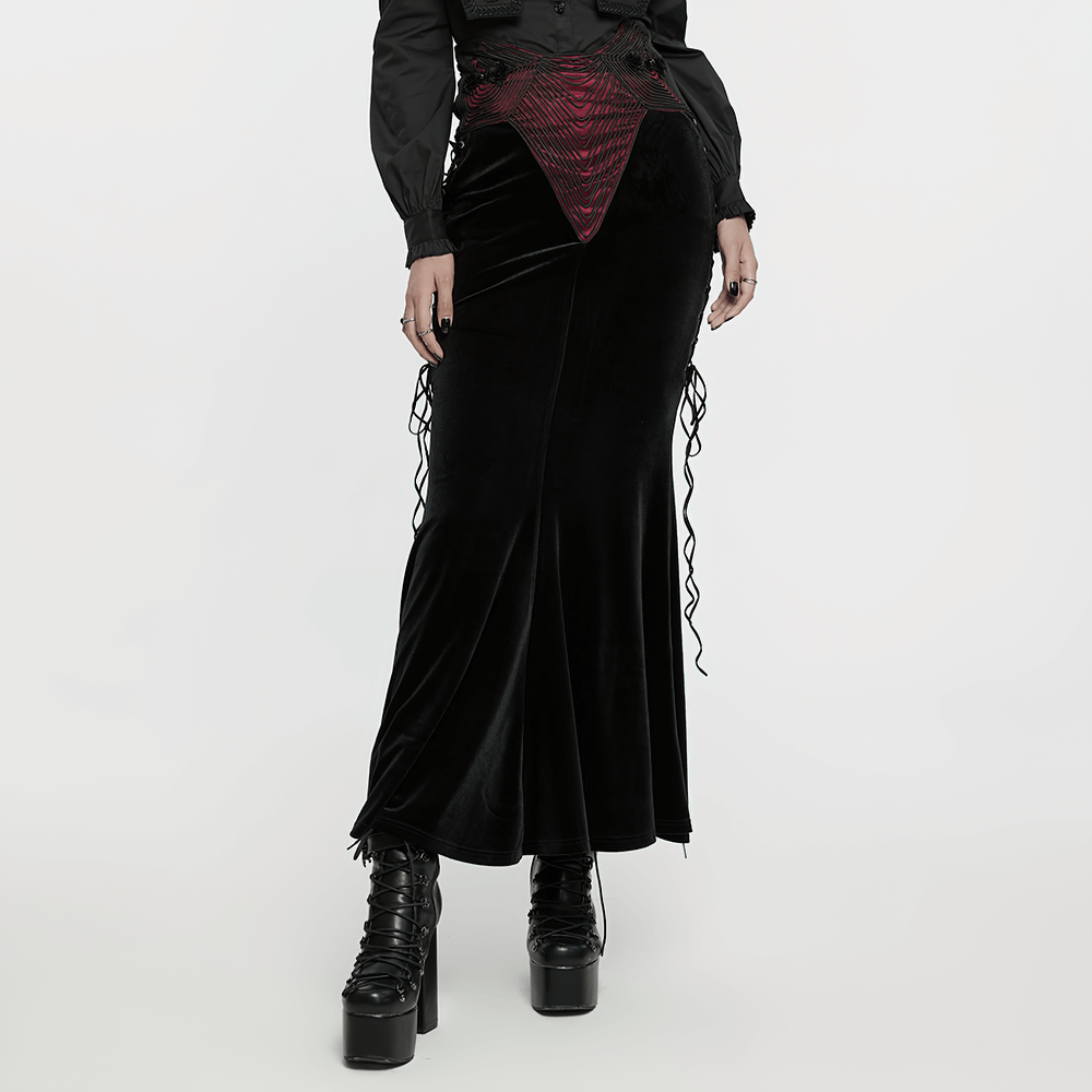 Gothic black velvet fishtail skirt with burgundy buckle detail, perfect for a unique, elegant style.