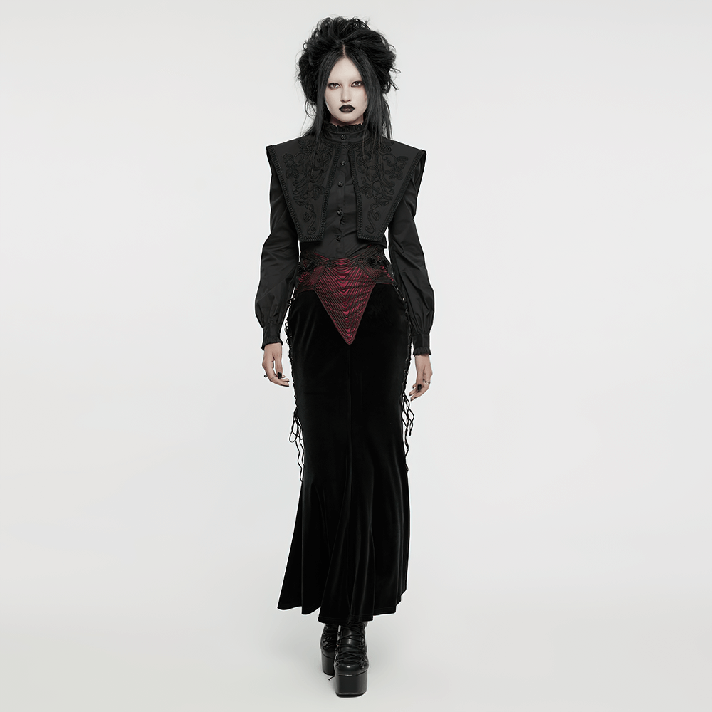 Elegant woman in a black velvet gothic fishtail skirt with burgundy accents, showcasing gothic fashion style.