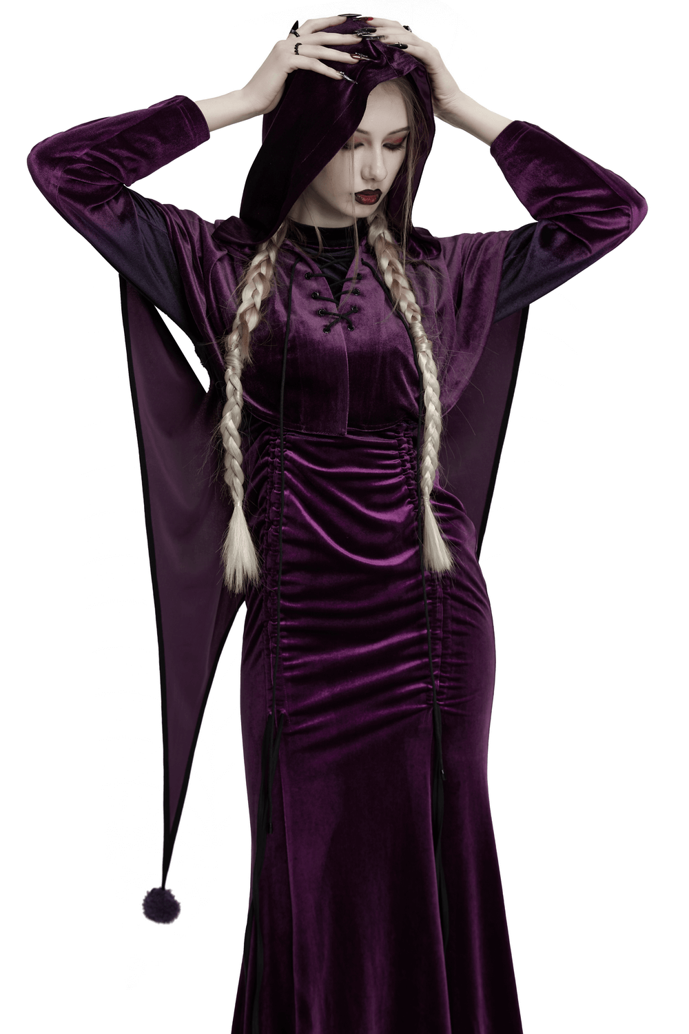 Woman in a purple velvet hooded cape with drawstring front, featuring whimsical fur ball tips and elegant elven-inspired design.