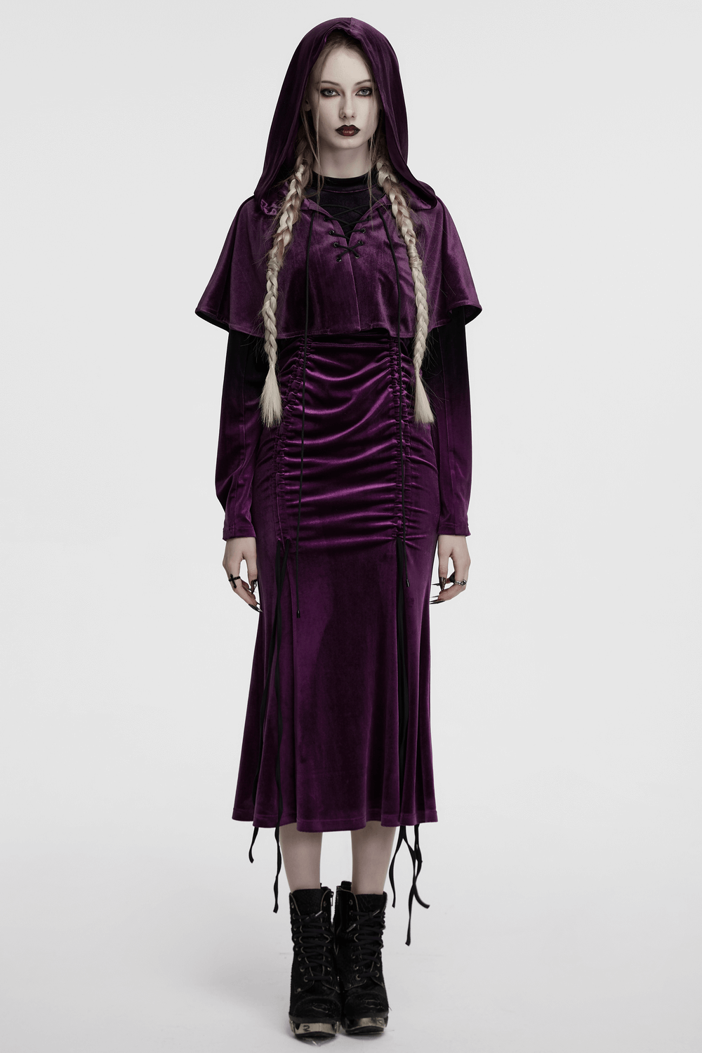 Women's purple velvet hooded cape with a drawstring front and whimsical fur ball tips, perfect for fantasy or gothic styles.