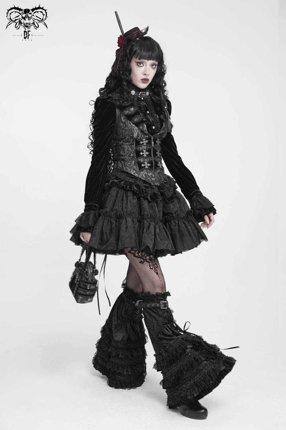 Women's Victorian Brocade Waistcoat with Cross Details showcased on a model in gothic fashion with dark layers.