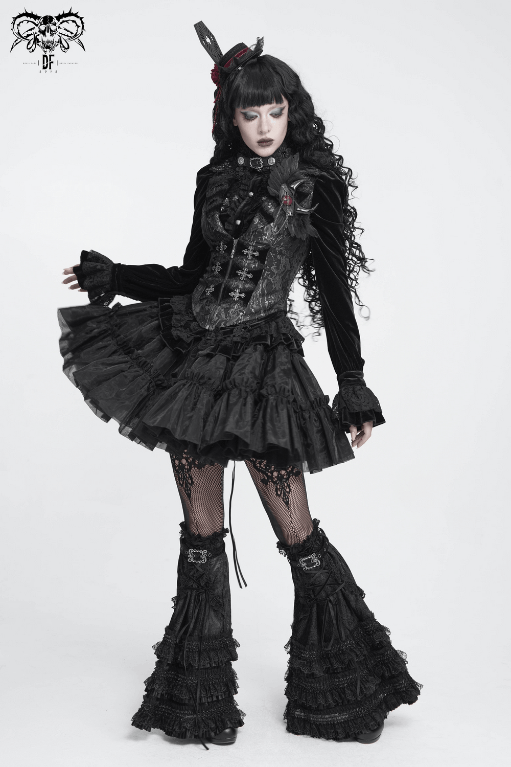 Women's Victorian Brocade Waistcoat with Cross Details worn by model with gothic style in dramatic black attire.