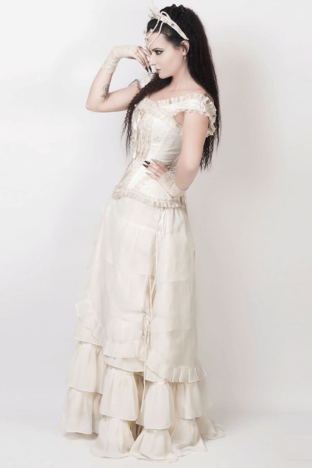 Model wearing elegant ivory Victorian layered maxi skirt with lace detailing and flowing georgette fabric.