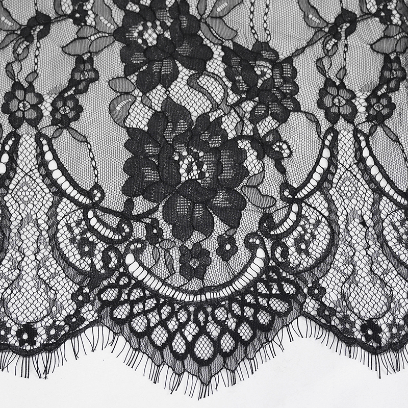 Intricate black floral lace fabric with detailed patterns for gothic and vintage styling.