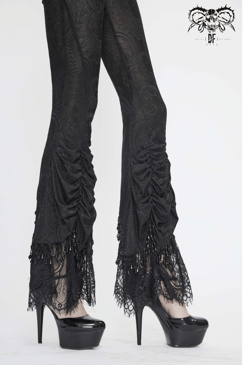 Women's black lace flared trousers with vintage gothic style and elegant high heels.