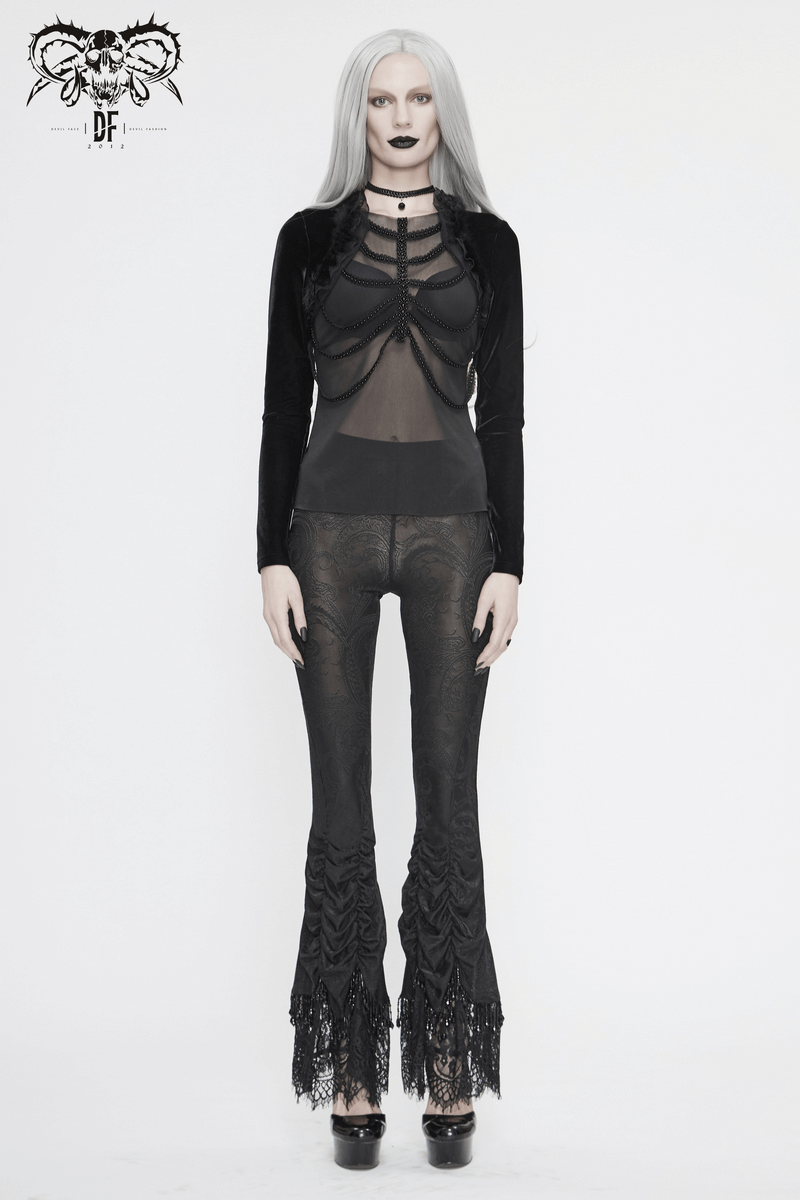 Model wearing women's vintage gothic black laced flared trousers, showcasing gothic style and elegant lace detailing.