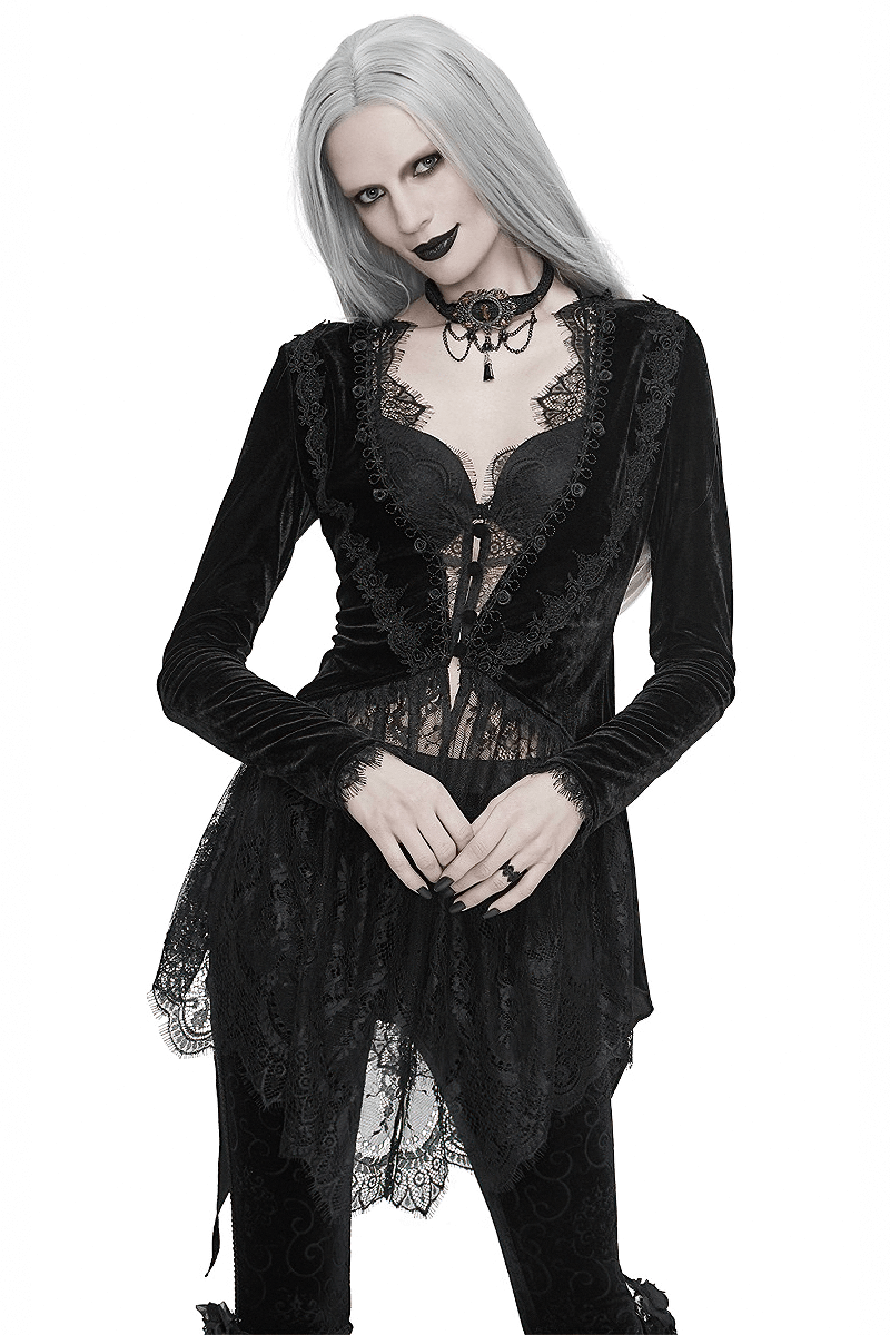 Stylish woman in a black velvet and lace gothic cape, exuding vintage elegance and dark fashion charm.