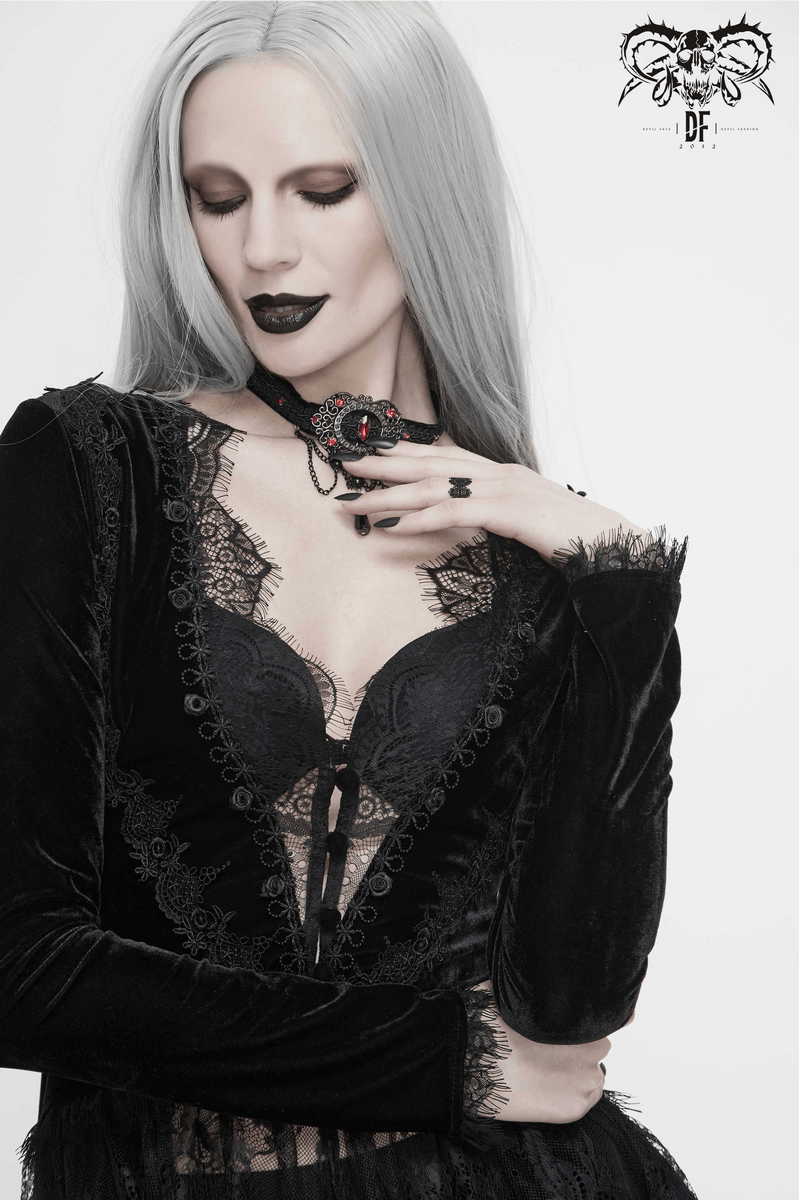 Gothic vintage-inspired model wearing a black velvet lace cape and dark makeup, showcasing a stylish and elegant look.