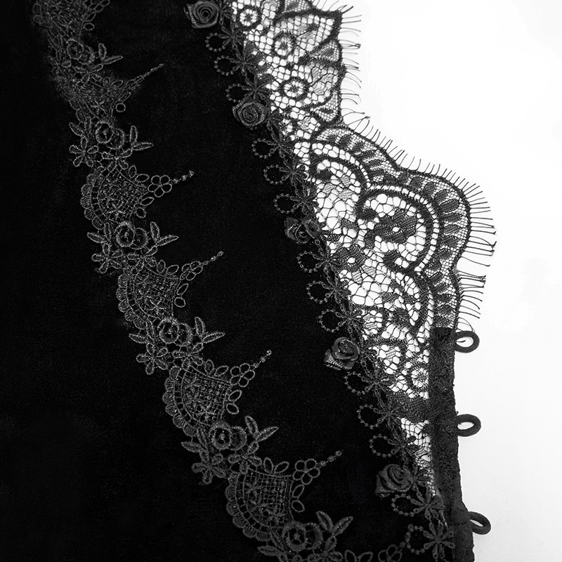 Close-up of black velvet cape with intricate lace detailing, showcasing gothic vintage style and elegance.