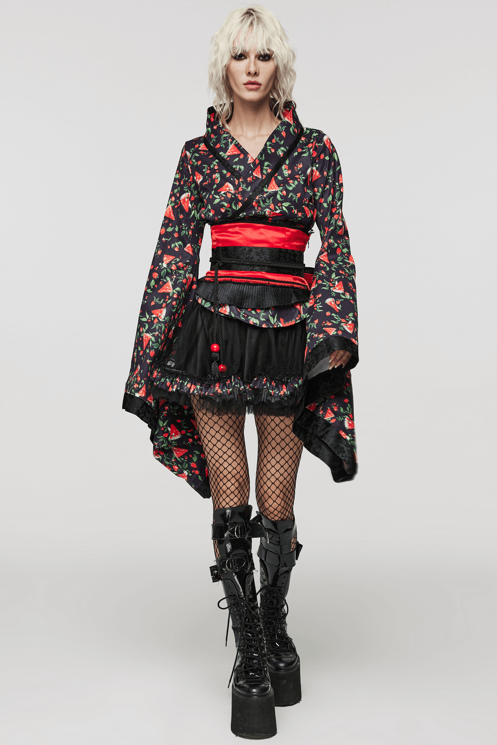 Stylish woman in a black watermelon print kimono set with red accents, perfect for cosplay or unique fashion statements.