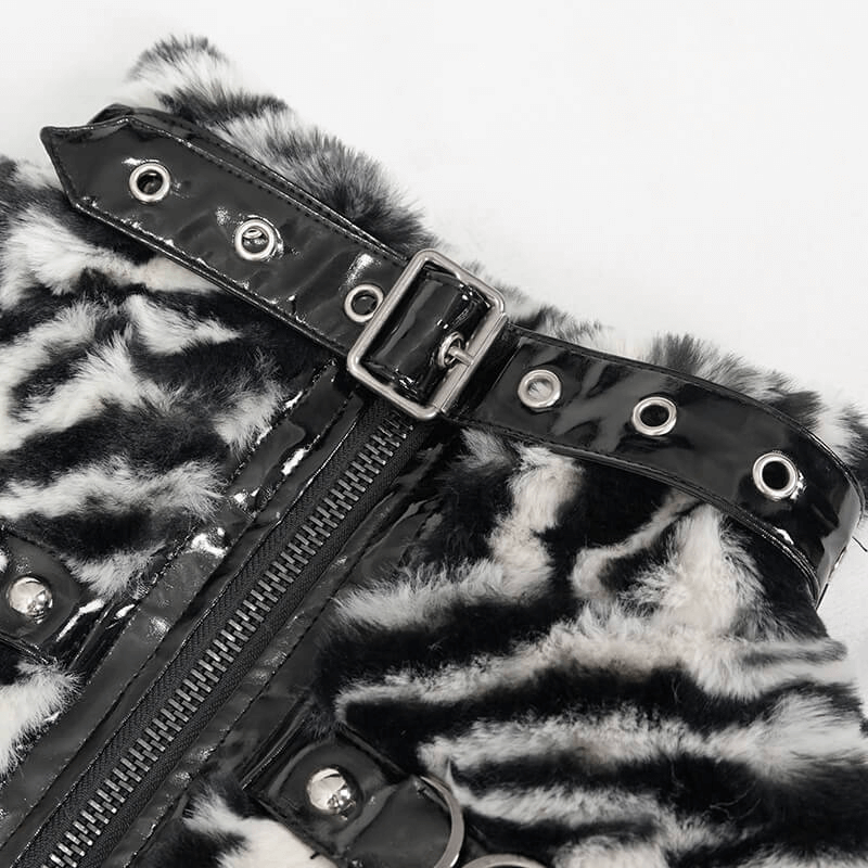 Close-up of women's zebra-print faux fur jacket featuring a zipper and stylish buckle detail.