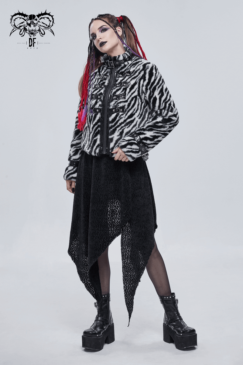 Stylish woman in zebra-print faux fur jacket, black dress, and platform boots, showcasing alternative fashion look.