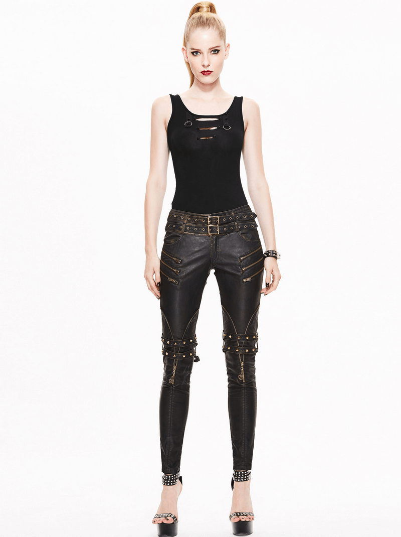 Stylish woman wearing black steampunk PU leather pants with zipper details and a sleeveless black top.