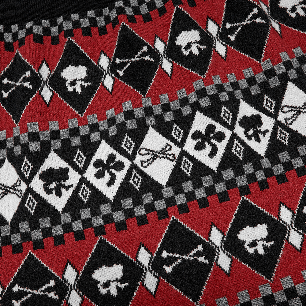 Close-up of red and black wool-blend knit skirt featuring geometric skull and playful motifs.