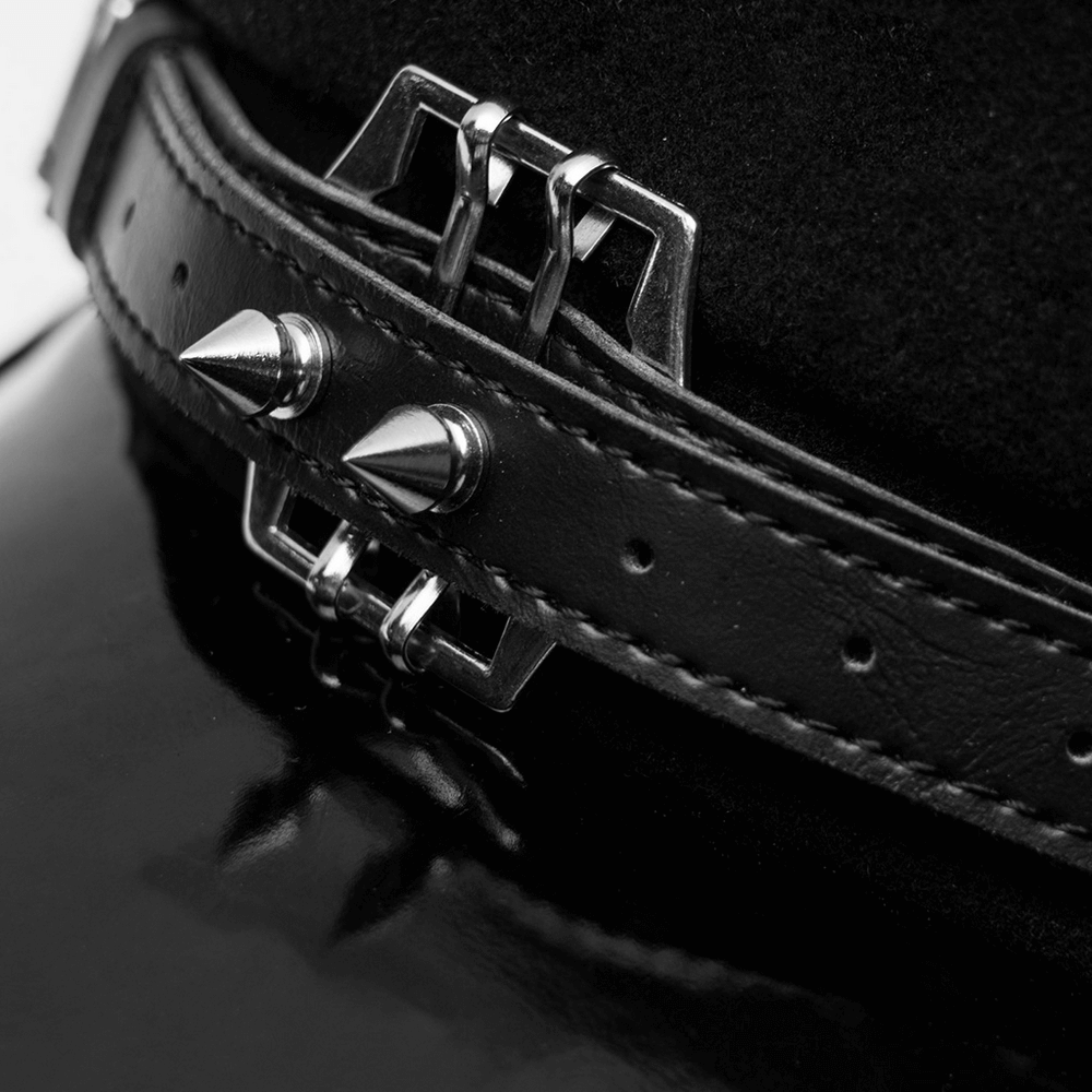 Close-up of punk-style cap featuring a black PU brim and metal spikes on the strap for a bold fashion statement.