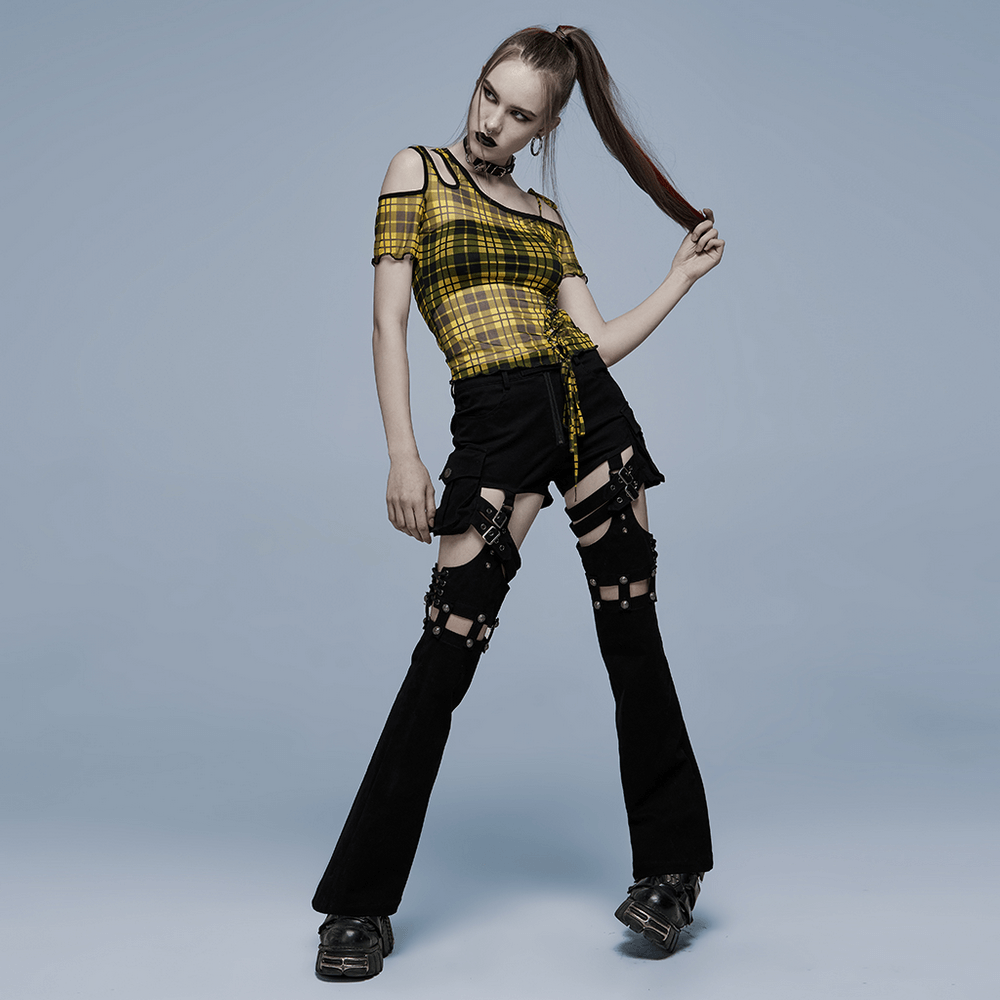 Model showcasing a yellow plaid mesh punk T-shirt with asymmetric neckline, styled with edgy black pants.