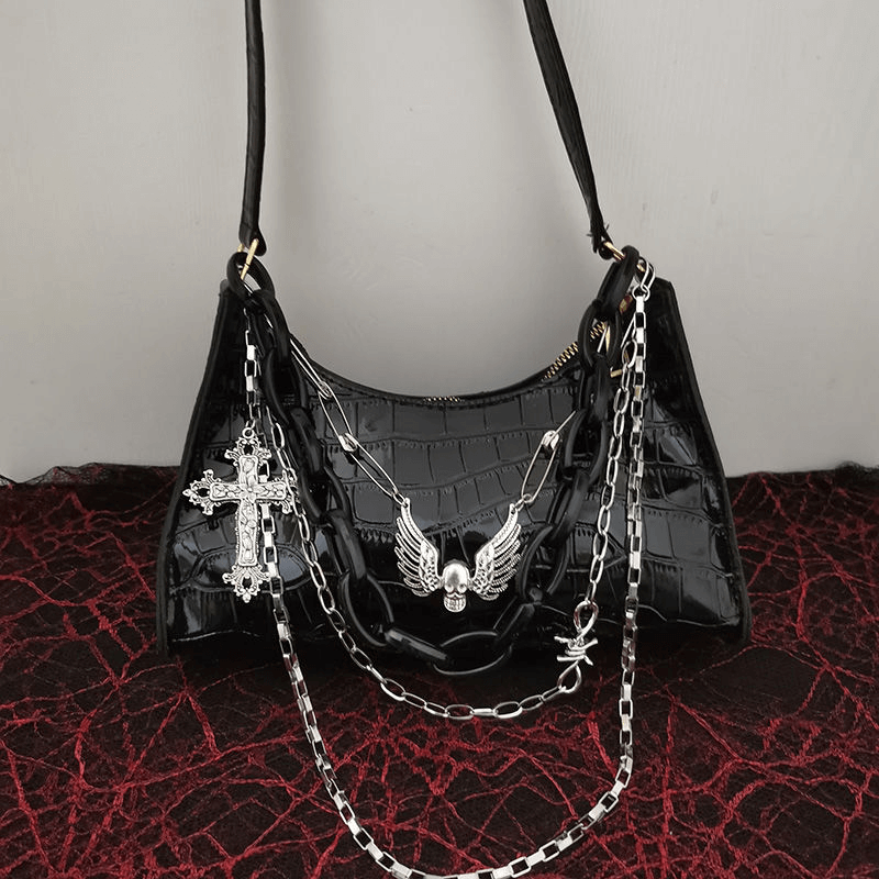 Zipper crocodile pattern handbag with punk skull and cross charm, featuring detachable chains and a sleek design.