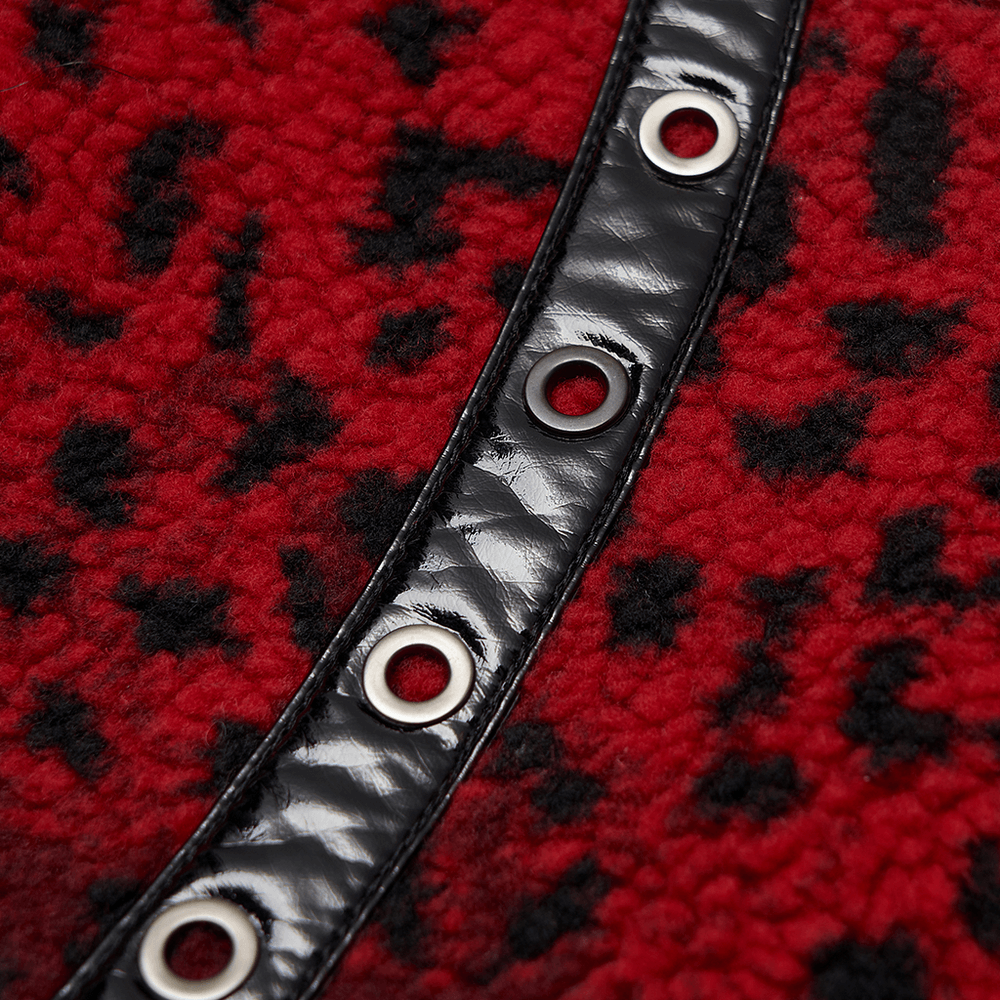 Close-up of red leopard print fabric with black PU leather and eyelets, showcasing punk style details.