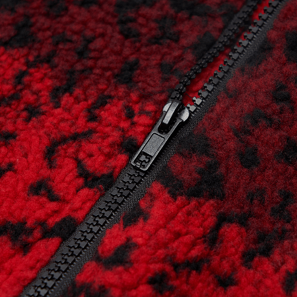 Close-up of the black zipper on a red leopard print mini skirt, showcasing punk style and edgy design.