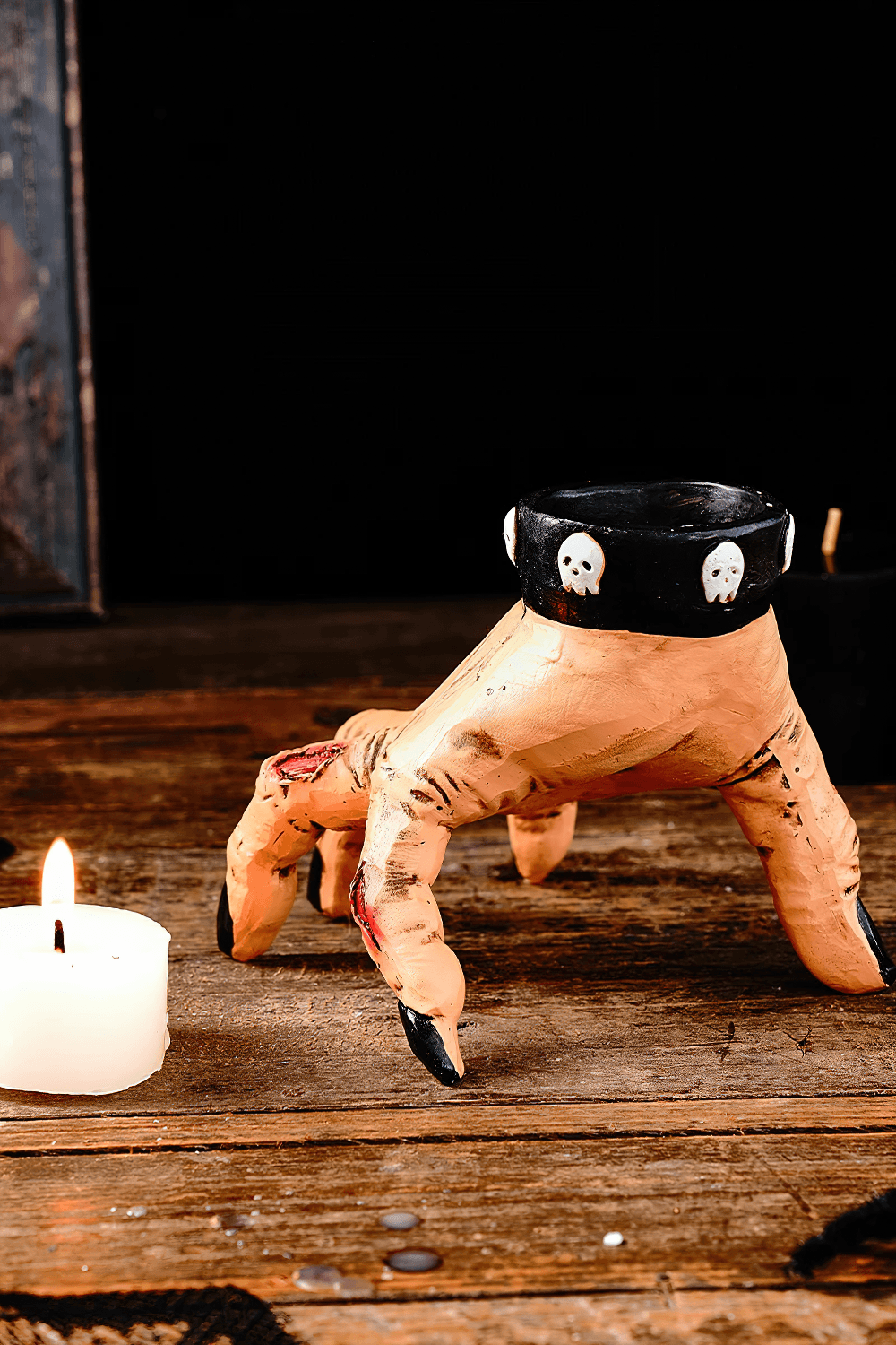 Zombie Hand Candle Holder with Gothic Skull Cuff showcasing a spooky hand design holding a candle.