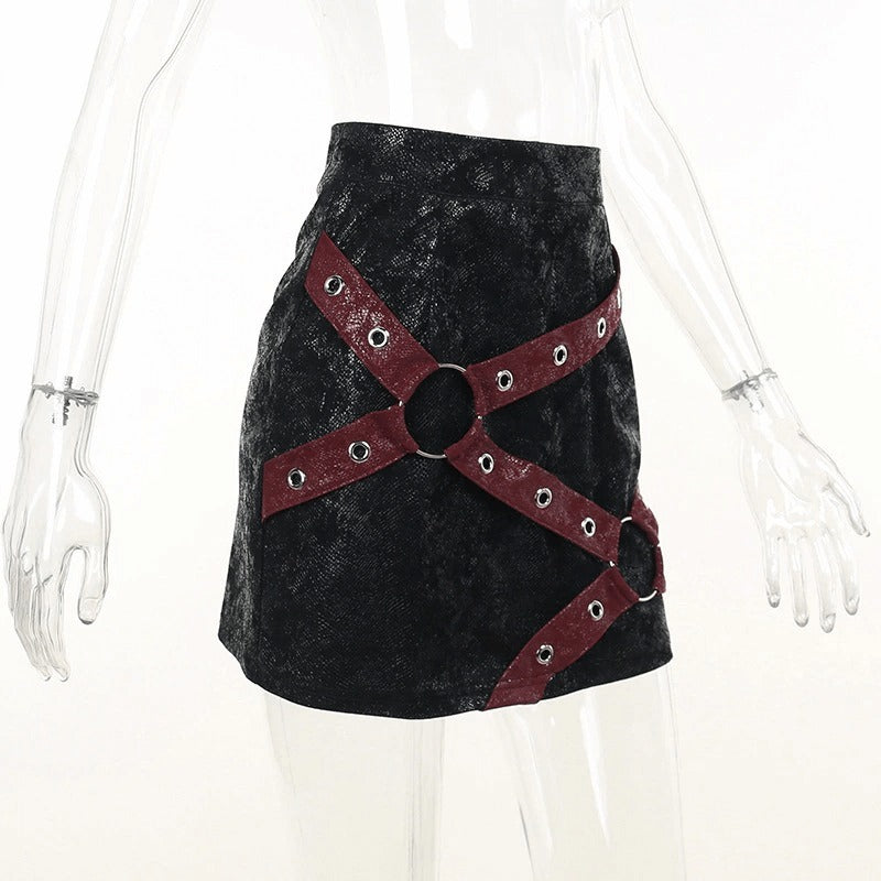 Women's high-waisted mini skirt with rivet straps and rings in a stylish punk design.