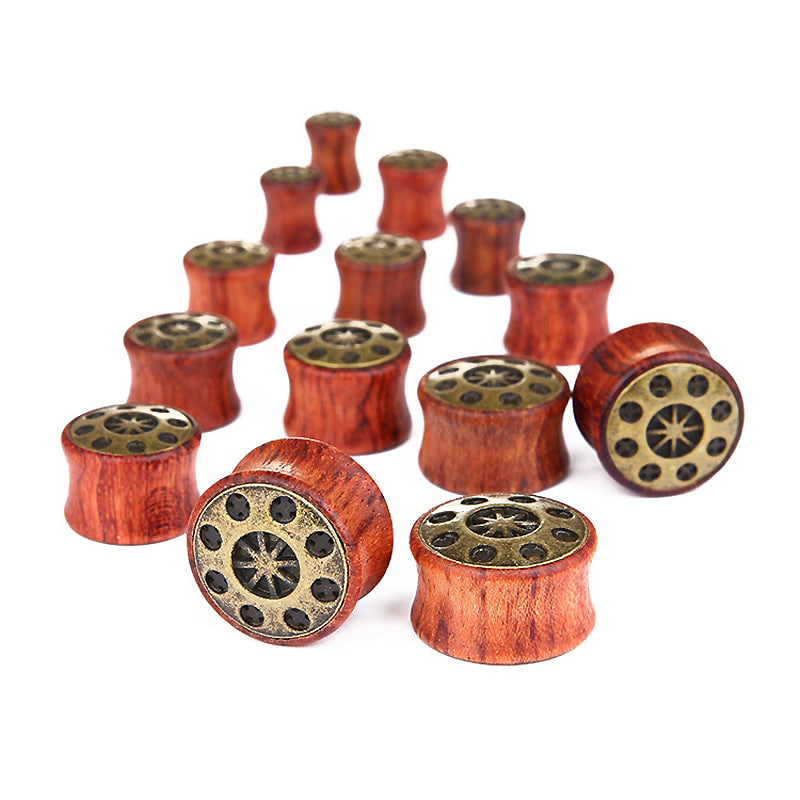 Trendy bamboo wood ear plugs in various sizes, featuring UFO designs for stylish ear stretching accessories.