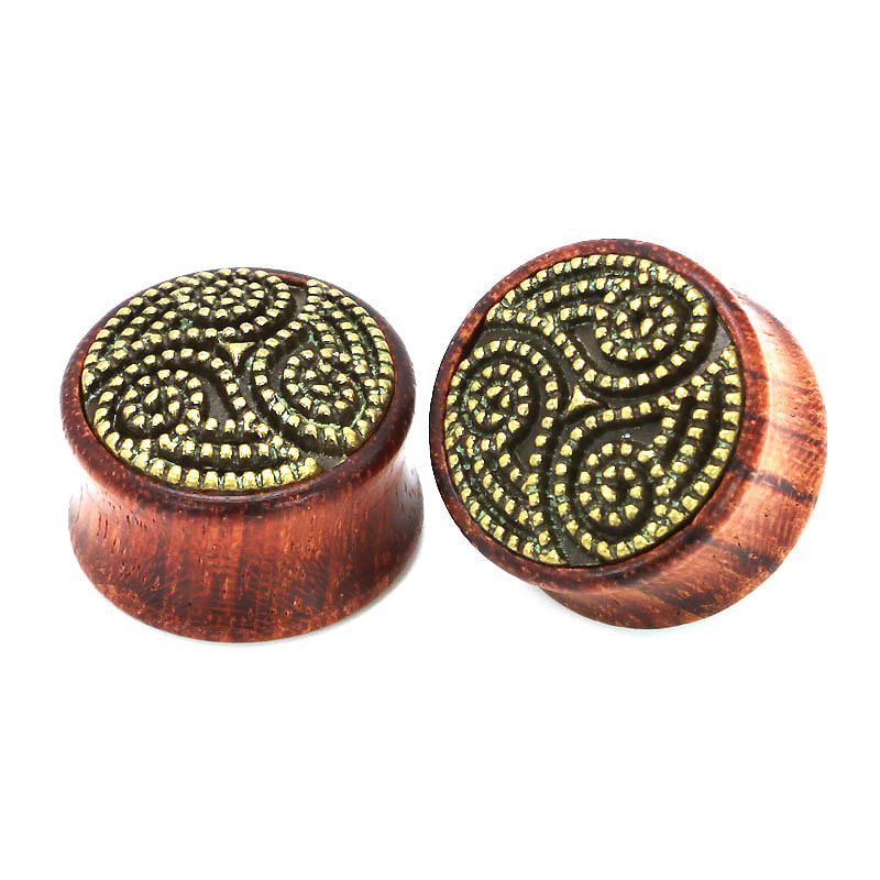Beautiful bamboo wood ear plugs with intricate golden swirl pattern, stylish and comfortable for expanders.