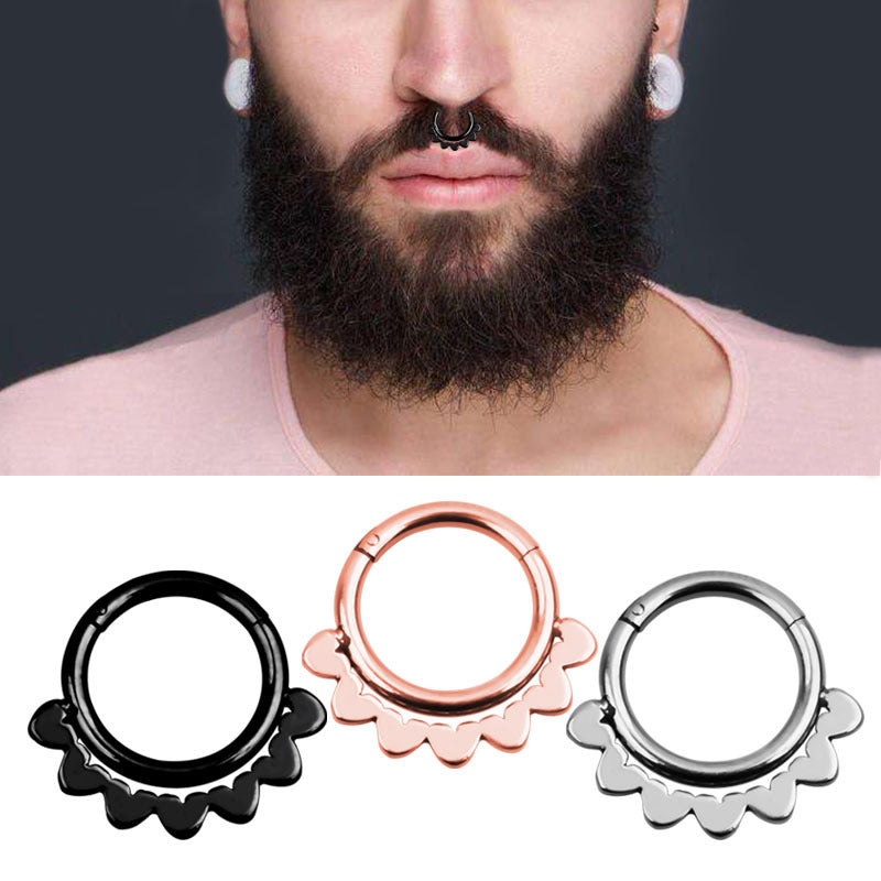 Stylish double-layered steel clicker nose hoop rings in black, rose gold, and silver, worn by a man with a beard.