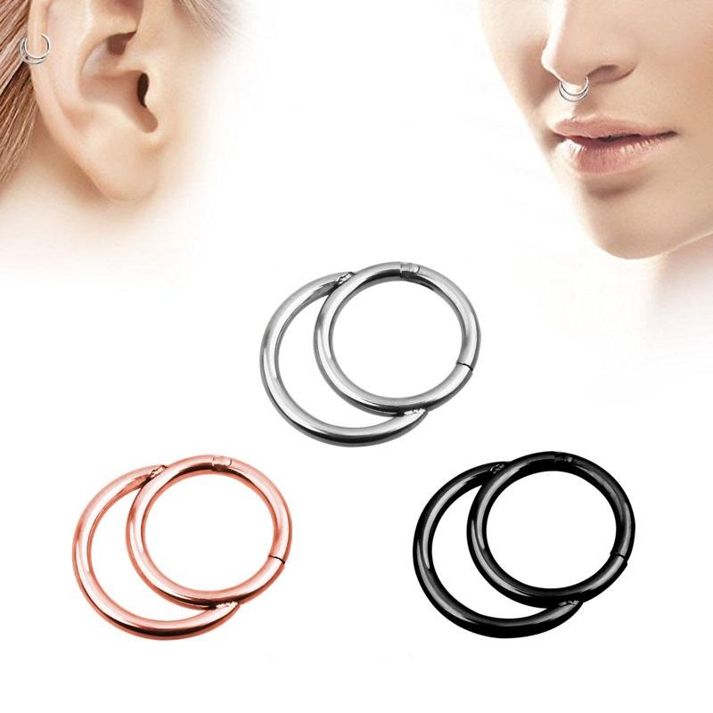 Stylish double-layered steel clicker nose hoops in black, silver, and rose gold colors, perfect for fresh piercings.