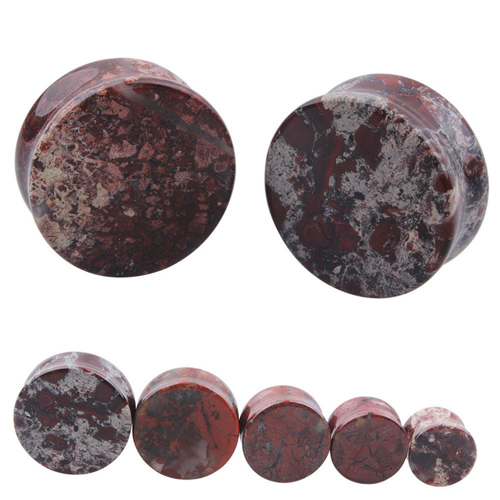 Stone ear plugs in various sizes showcasing a beautiful bloodstone design for unique body jewelry.