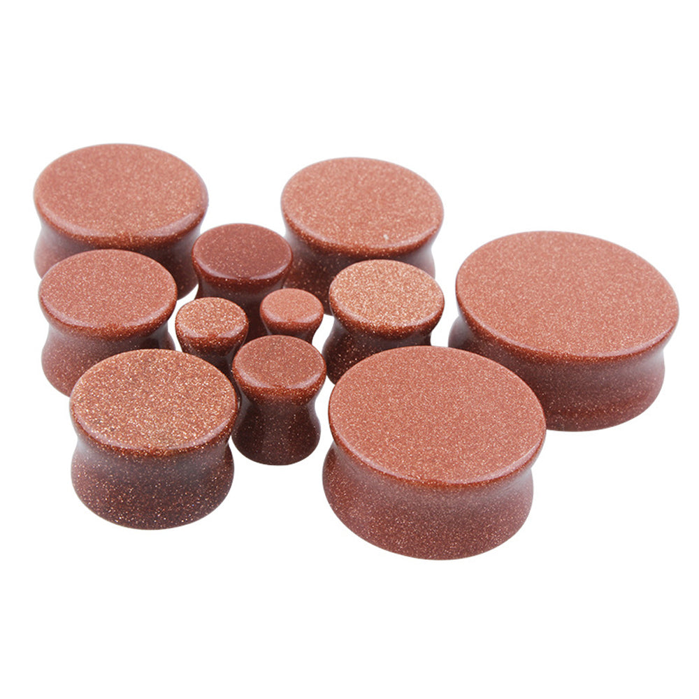 Set of brown golden sand stone ear plugs and gauges for body jewelry, perfect for stylish ear stretching.