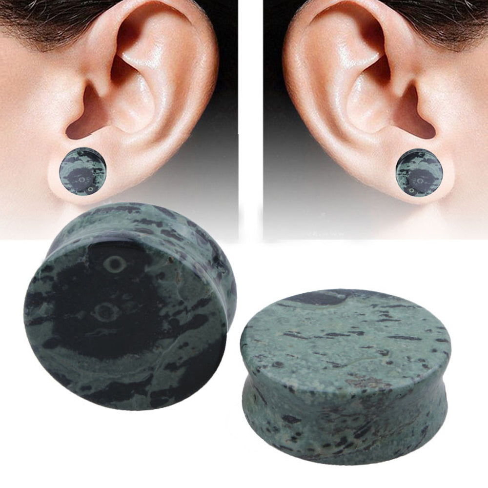 Unisex green eye stone ear plugs and gauges, perfect for body jewelry enthusiasts, showcasing trendy round design.