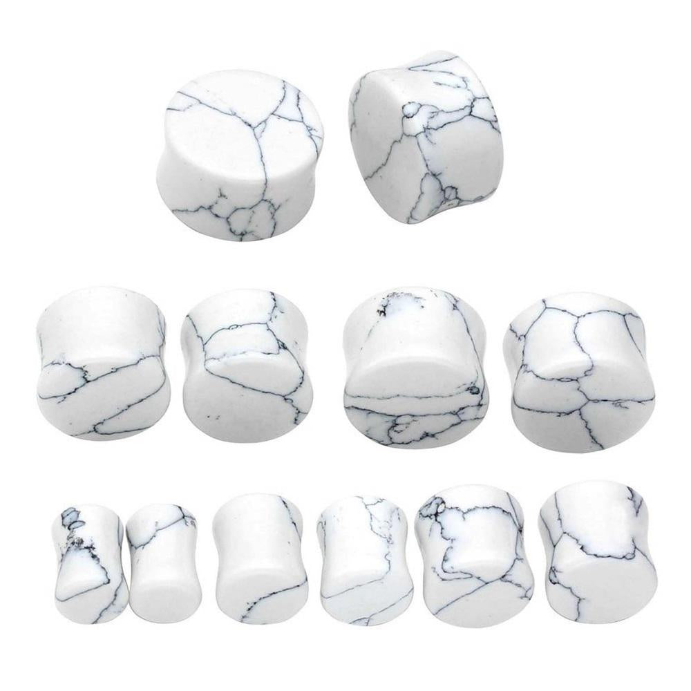 Collection of white turquoise stone ear plugs and gauges, perfect for body jewelry enthusiasts.